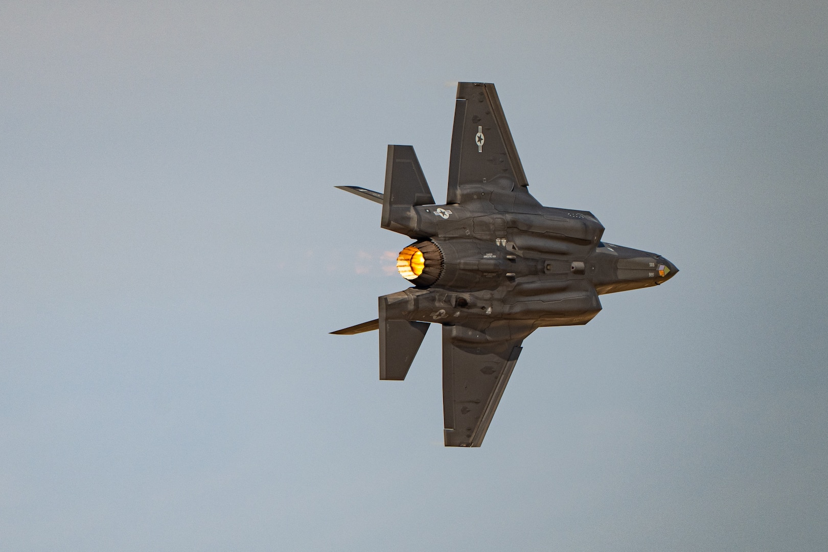 A U.S. Air Force F-35A Lightning II aircraft flown by the F-35 aerial demonstration team assigned to the 388th Fighter Wing at Hill Air Force Base, Utah, performs aerial maneuvers Nov. 15, 2025, over Al Maktoum International Airport in Dubai, United Arab Emirates. The fifth-generation stealth fighter rehearsed its performance prior to the Dubai Airshow 2025. (U.S. Air Force photo by Tech. Sgt. Justin Norton)