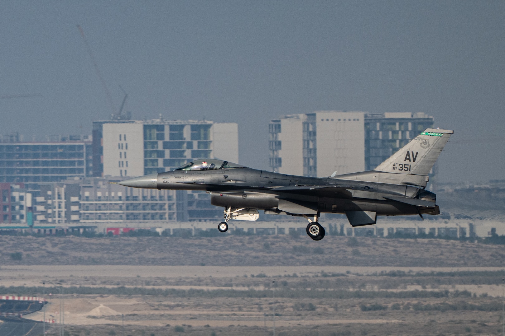 An F-16C Fighting Falcon assigned to the 555th Fighter Squadron from Aviano Air Base, Italy, lands Nov. 16, 2025, at Al Maktoum International Airport in Dubai, United Arab Emirates. The multi-role fighter aircraft rehearsed its performance prior to the Dubai Airshow 2025. (U.S. Air Force photo by Tech. Sgt. Justin Norton)