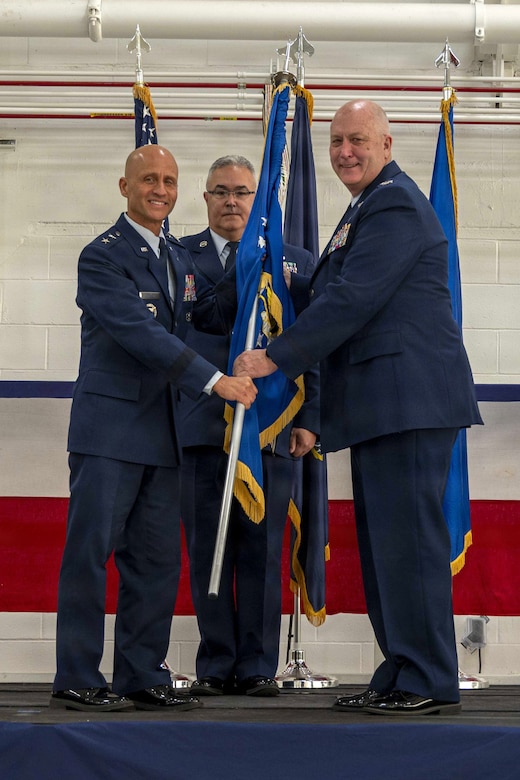 Maj. Gen. Terrence L. Koudelka, Jr., left, the Deputy Adjutant General-Air and Commander, Pennsylvania Air National Guard, receives the 171st Air Refueling Wing guidon from Col. Raymond L. Hyland Jr., former 171st ARW commander, during a change of command ceremony Oct. 26, 2025, near Pittsburgh, Pennsylvania. Upon taking command, Col. Ryan D. Strong became the wing’s 24th commander. (U.S. Air National Guard photo by Tech. Sgt. Zoe M. Wockenfuss)
