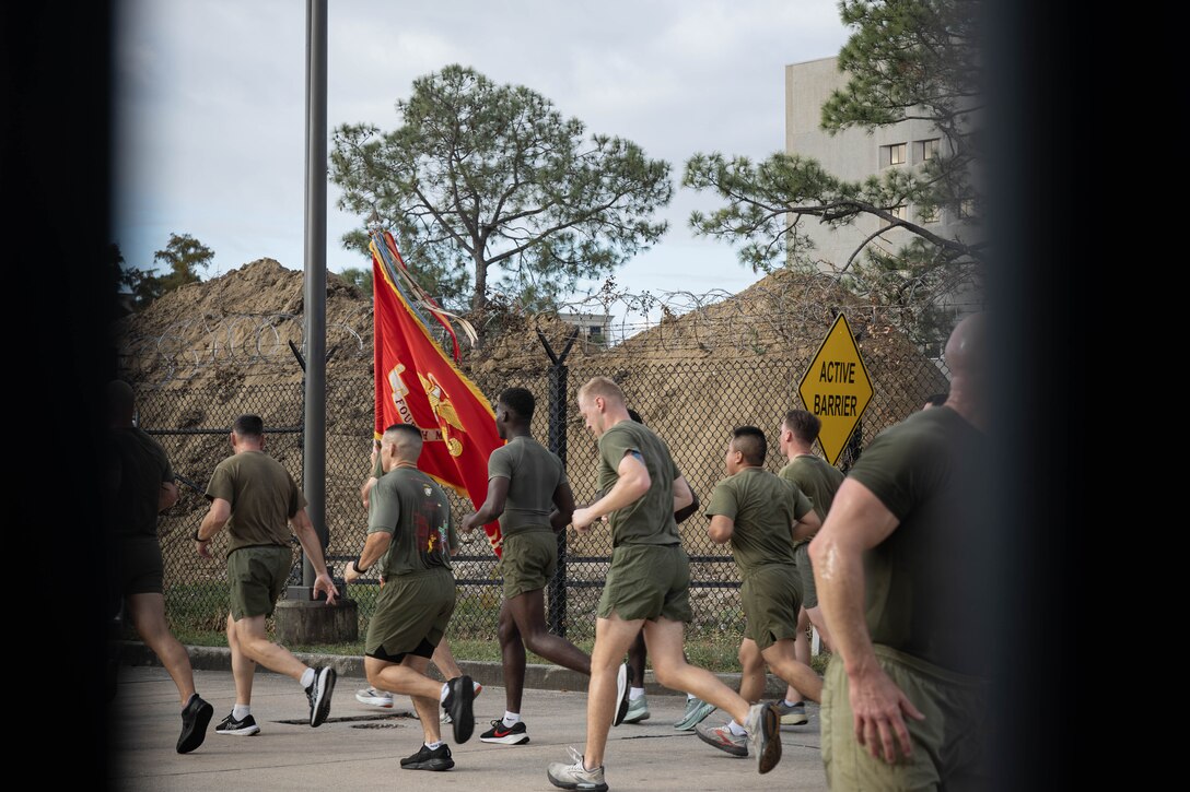 U.S. Marines and sailors with Marine Forces Reserve and Marine Forces South participate in an annual birthday motivational run celebrating the 250th birthday of the U.S. Marine Corps, in New Orleans, Nov. 7, 2025. The run started at the Marine Corps Support Facility New Orleans and traveled along the Mississippi River ending back at MCSF. The run celebrates the history of the Marine Corps and creates esprit de corps and comradery among Marines. (U.S. Marine Corps photo by Lance Cpl. Priscilla Flores)