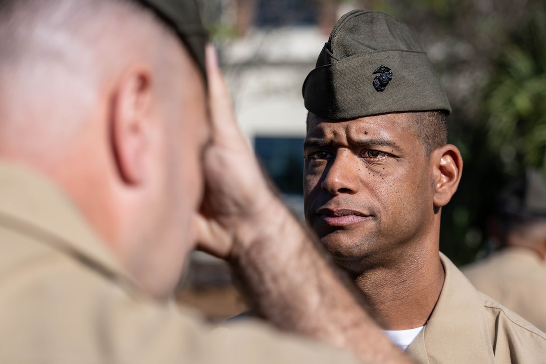 U.S. Marine Corps 1st Sgt. Alfred Brooks, a command senior enlisted leader with Force Headquarters Group, Marine Forces Reserve, inspects a Marine during a uniform inspection at Marine Corps Support Facility New Orleans, Oct. 24, 2025. The inspection was conducted to evaluate the Marines’ appearance and adherence to standards while promoting discipline and attention to detail. (U.S. Marine Corps photo by Lance Cpl. Van Hoang)