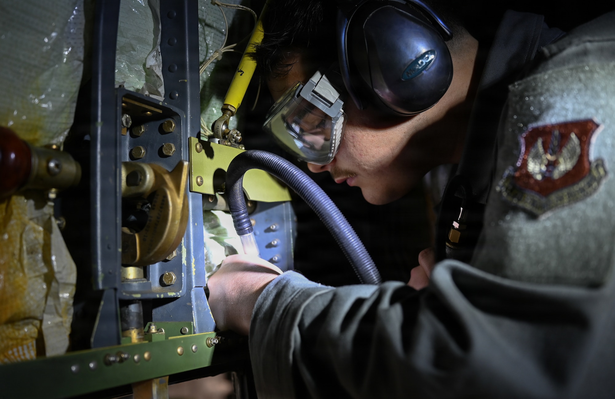 U.S. Air Force Senior Airman Kadin Trahan, 86th Maintenance Squadron aircraft structural maintenance journeyman, removes excess metal from a jettison bracket for a C-130J Super Hercules at Ramstein Air Base, Germany, Nov. 13, 2025.