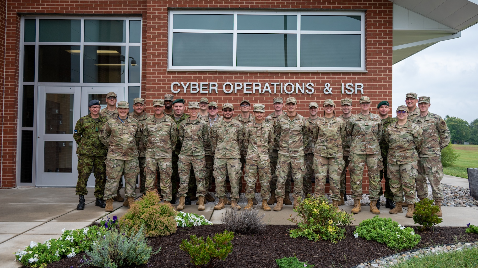 Maryland National Guard cyber operators and members of the Estonian Defence Forces pose for a group photo during Baltic Blitz 25 at Warfield Air National Guard Base at Martin State Airport, September 25, 2025. Members of the Estonian Defence Forces led the exchange by conducting workshops throughout the week focusing on tactics and capabilities related to critical thinking, as well as the collection and management of information. (U.S. Air National Guard Photo by Airman 1st Class Sarah Hoover)