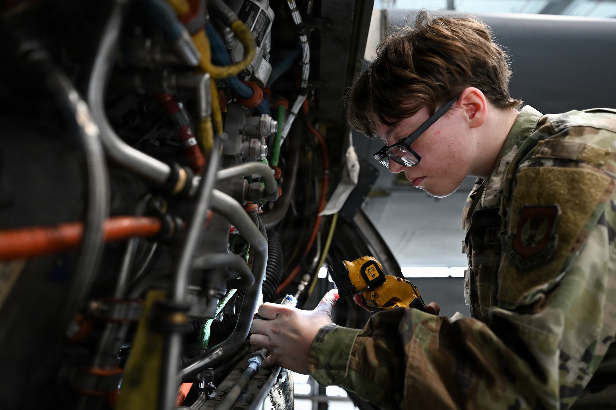 U.S. Air Force Senior Airman Heather Cummings, 86th Aircraft Maintenance Squadron aerospace inspection journeyman, reinstalls electrical connectors on a C-130J Super Hercules at Ramstein Air Base, Germany, Nov. 13, 2025.