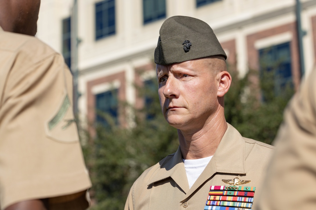 U.S. Marine Corps Master Gunnery Sgt. John Haynes, an administration chief with 4th Marine Air Wing, Marine Forces Reserve, prepares to inspect a Marine during a uniform inspection at Marine Corps Support Facility New Orleans, Oct. 24, 2025. The inspection was conducted to evaluate the Marines’ appearance and adherence to standards while promoting discipline and attention to detail. (U.S. Marine Corps photo by Lance Cpl. Van Hoang)