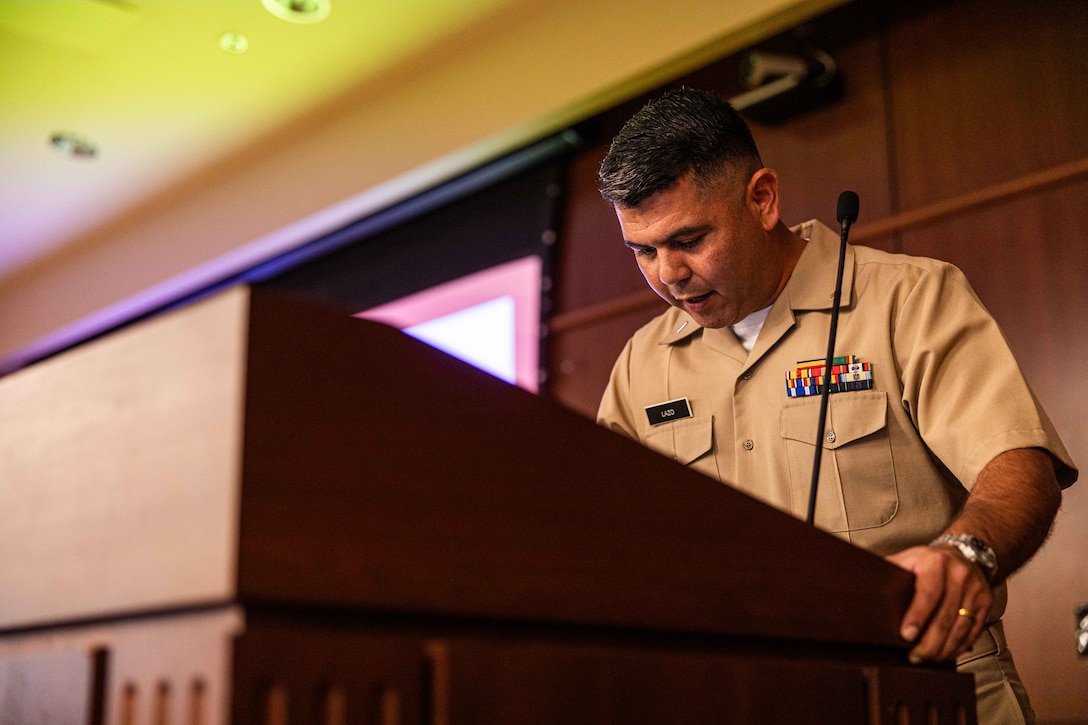 U.S. Navy Lt. j.g. Henry Lazo, a chaplain with Headquarters Battalion, Marine Forces Reserve gives the invocation during the Navy's 250th birthday ceremony at Marine Corps Support Facility New Orleans, Oct. 15, 2025. Sailors come together to celebrate a new year for the Navy. MARFORRES has more than 1,000 Sailors serving at more than 150 Marine Corps Reserve training centers across the nation supporting the Total Force to be ready to fight and win our nation's battles. (U.S. Marine Corps photo by Lance Cpl. Edward Spears)