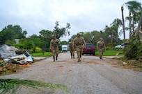 U.S. Soldiers with the Florida and South Carolina Army National Guard search for residents in need of assistance near Stuart, Florida, in the aftermath of Hurricane Milton, Oct. 10, 2024.