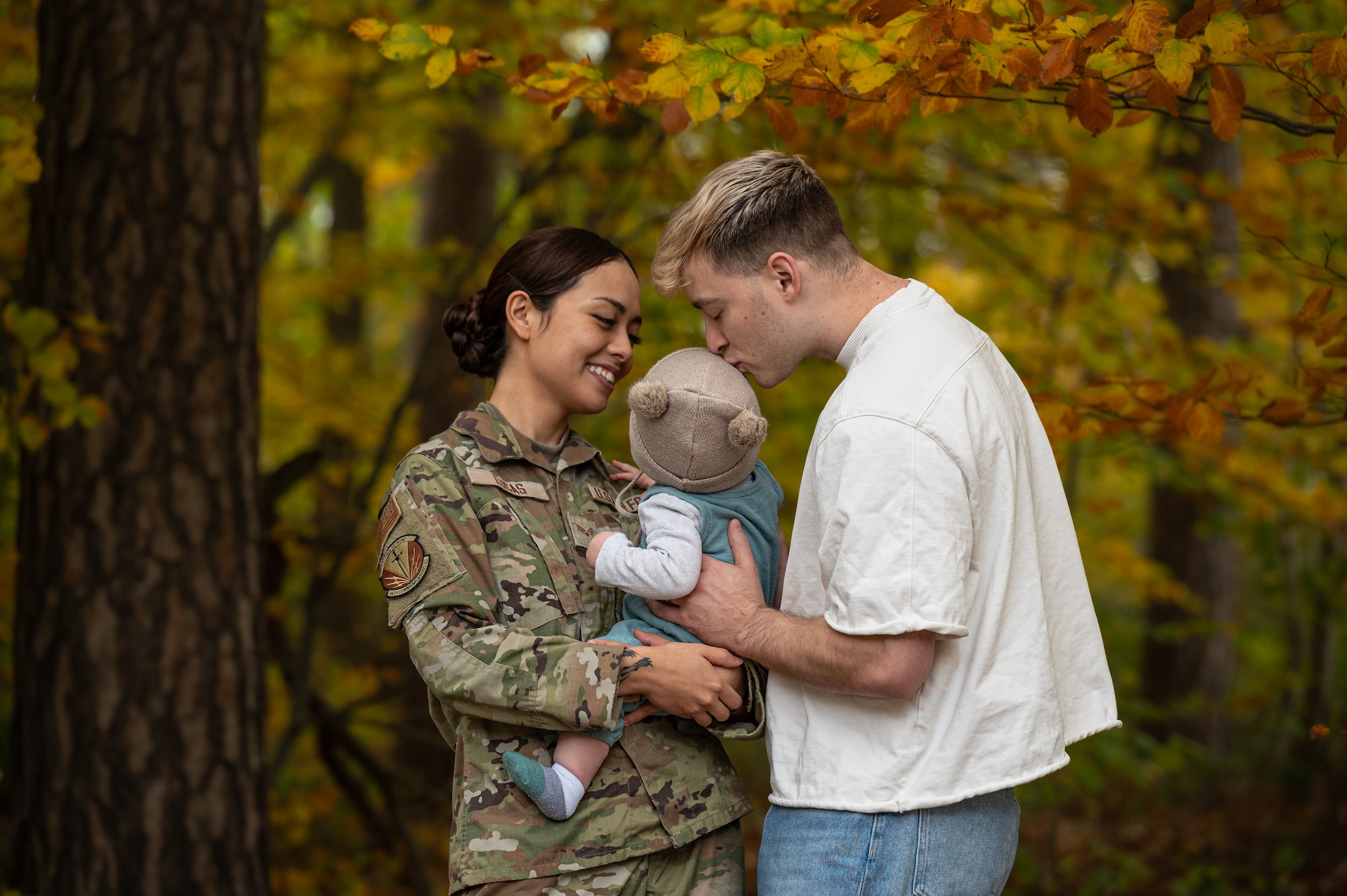 U.S. Air Force Senior Airman Elena Lucas, 86th Communications Squadron client systems technician, her husband, Mason Edlin, and their daughter Eumi pose for a photo at Ramstein Air Base, Germany, Oct. 31, 2025. On Oct. 12, 2025, U.S. Air Force Senior Airman Hannah Lillund, 569th United States Forces Police Squadron vehicle registration clerk, provided infant CPR to Eumi when she was choking. (U.S. Air Force photo by Senior Airman Jared Lovett)
