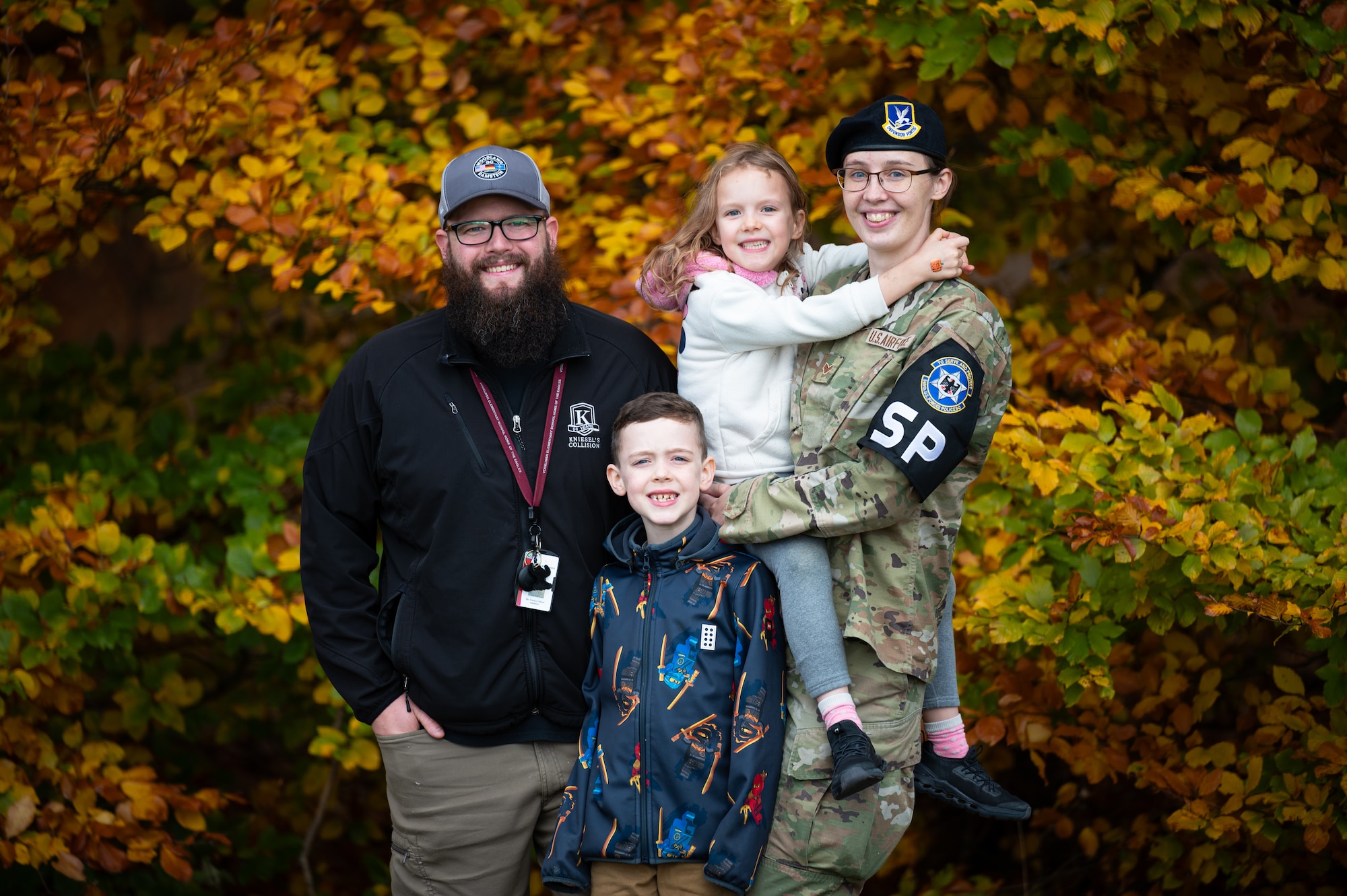 U.S. Air Force Senior Airman Hannah Lillund, 569th United States Forces Police Squadron vehicle registration clerk and her husband Tanner, Vogelweh Elementary School substitute teacher, smile for a photo with their children Killian and Serena, at Vogelweh Military Complex, Germany, Nov. 3, 2025. The Lillund family responded as a team to save the life of a nine-month-old girl who was choking on Oct. 12. (U.S. Air Force photo by Senior Airman Jared Lovett)