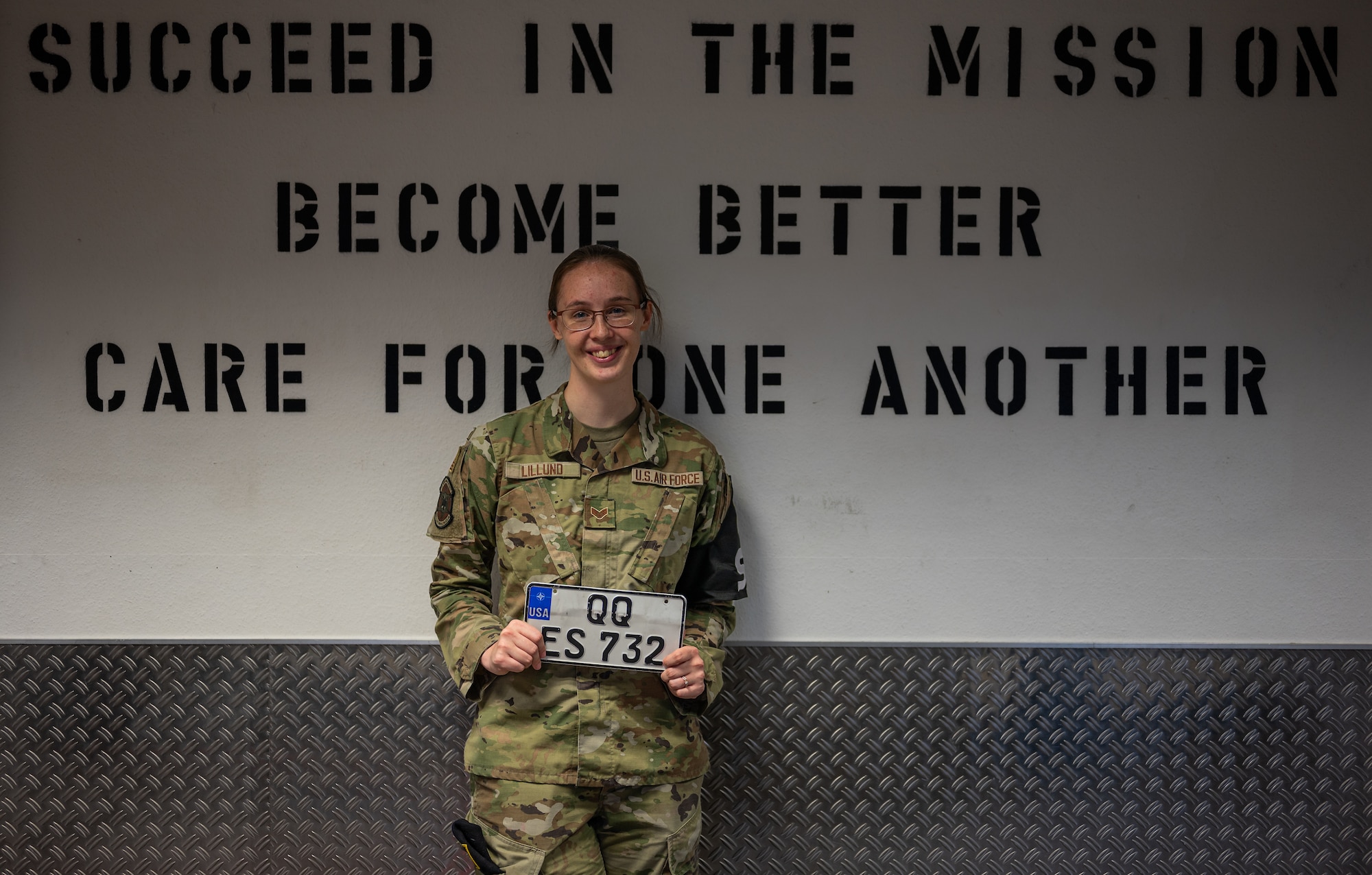 U.S. Air Force Senior Airman Hannah Lillund, 569th United States Forces Police Squadron vehicle registration clerk, smiles for a photo at Kapaun Air Station, Germany, Nov. 3, 2025. On Oct. 12, 2025, Lillund responded to an emergency when a nine-month-old girl began choking and successfully performed infant CPR techniques to restore the child’s airway. (U.S. Air Force photo by Senior Airman Jared Lovett)
