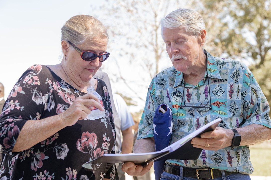 Wayne Bodker reads the history of U.S. Marine Corps Sgt. Frank Schmaltz at the Garden of Memories Funeral Home and Cemetery, Metairie, Louisiana, Oct. 13, 2025. Marine Corps Funeral Honors stands committed to ensuring that every Marine who has served receives the proper respects, serving as a final tribute to their life and a lasting demonstration of the nation's appreciation for their unwavering defense of our country, whether in times of conflict or peace. (U.S. Marine Corps photo by Lance Cpl. Van Hoang)