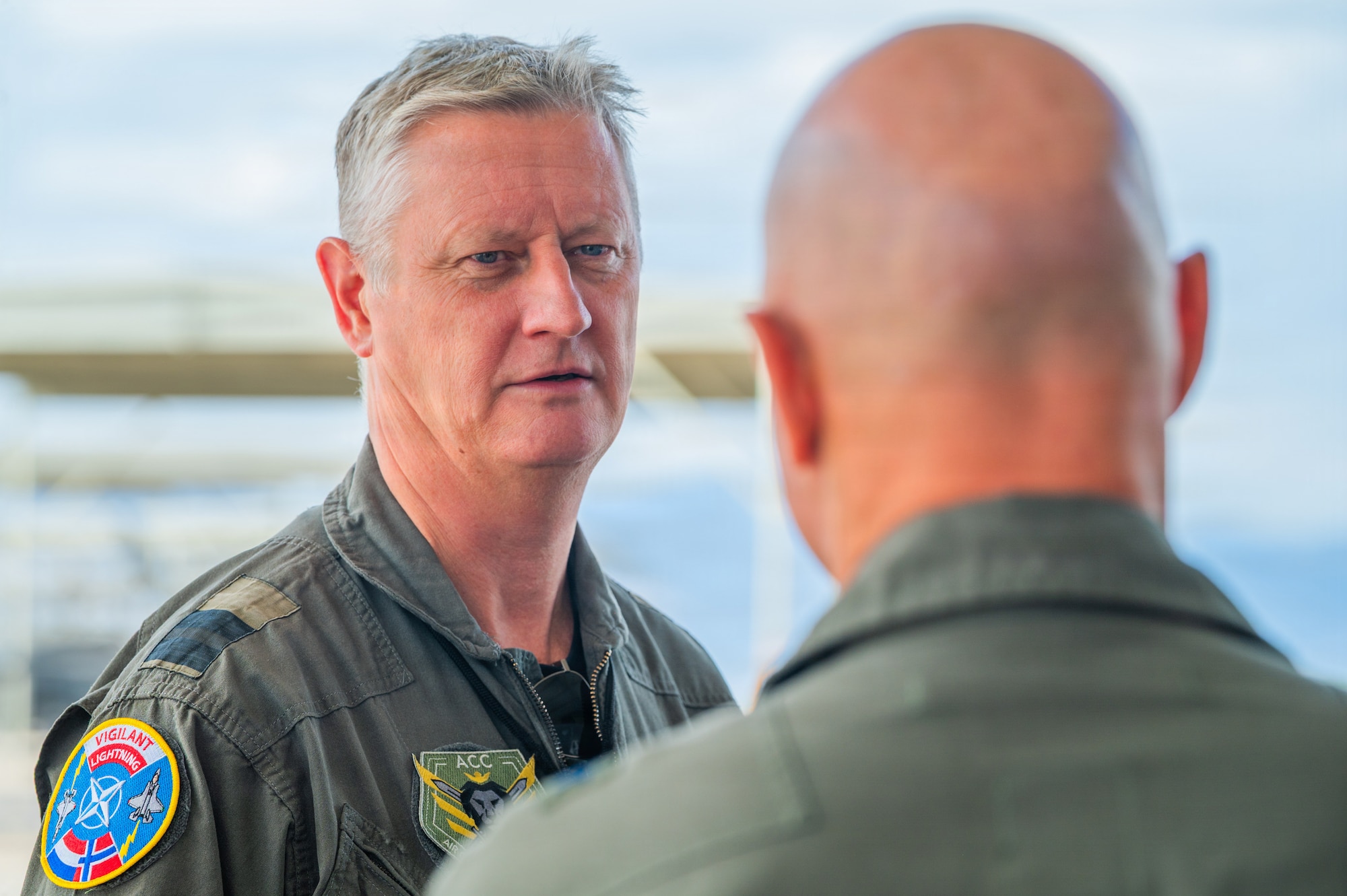 Royal Netherlands Air and Space Force Brig. Gen. Marcel van Egmond (left), RNLASF Air Combat Command commander, speaks with U.S. Air Force Brig. Gen. David Berkland (right), 56th Fighter Wing commander, during a base visit