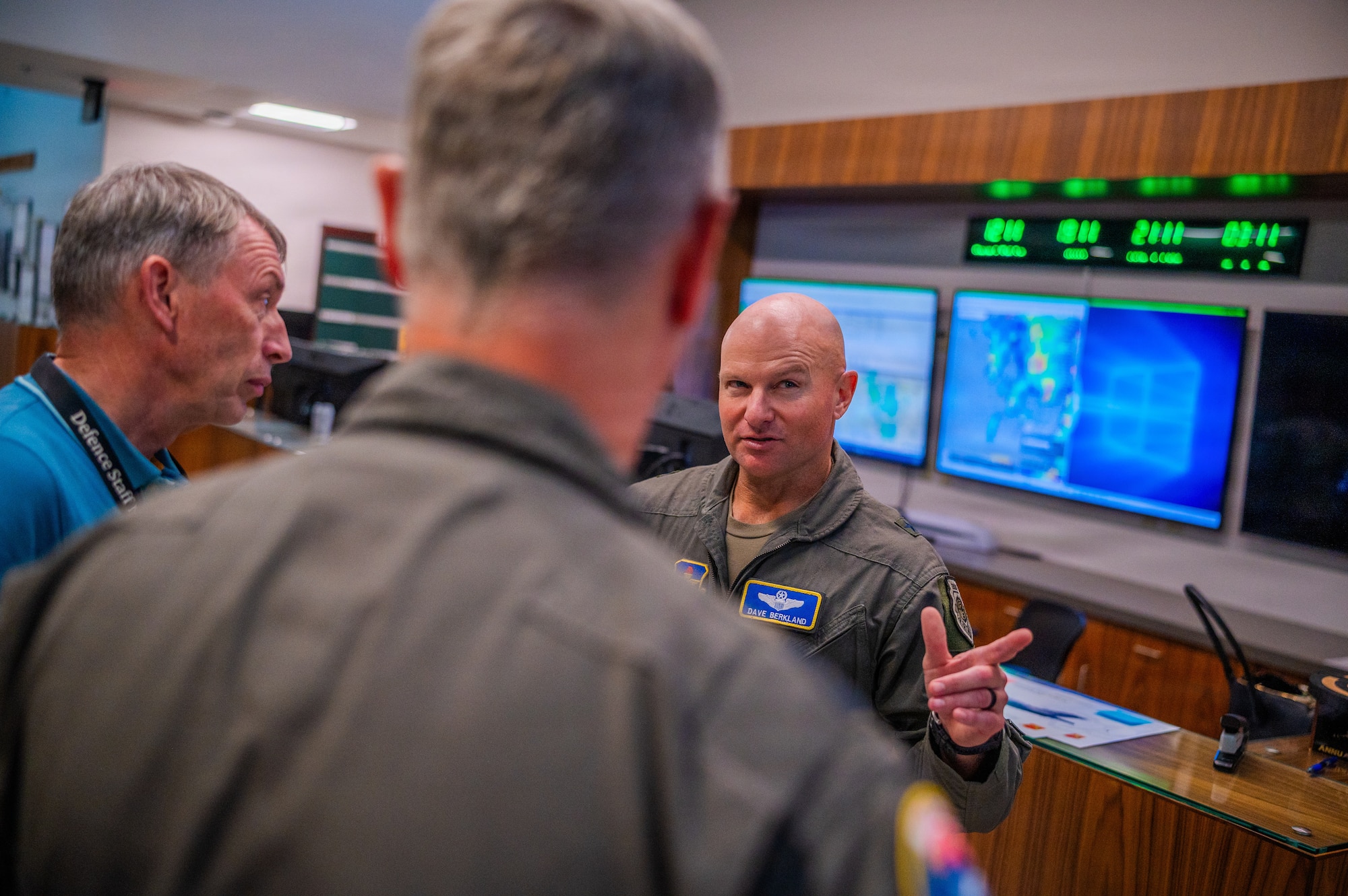 U.S. Air Force Brig. Gen. David Berkland (right), 56th Fighter Wing commander, speaks with Royal Netherlands Air and Space Force Brig. Gen. Marcel van Egmond (center), RNLASF Air Combat Command commander, and Brig. Gen. Peter Tankink (left), Joint Force Command Brunssum assistant chief of staff, during a base visit