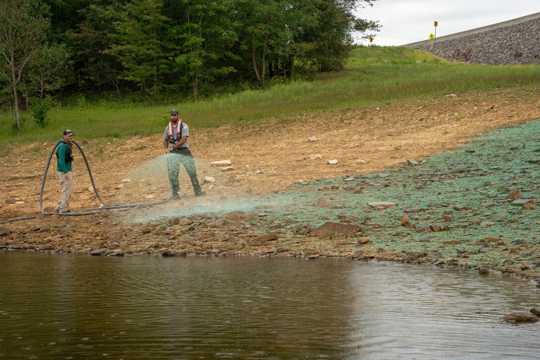 Rough River Lake Park Ranger Adam Taylor and KDFWR’s Jeremy Shiflet use a hydro seeder to restore vegetation on eroding shorelines at Rough River Lake in Falls of Rough, Kentucky, Sept. 10.