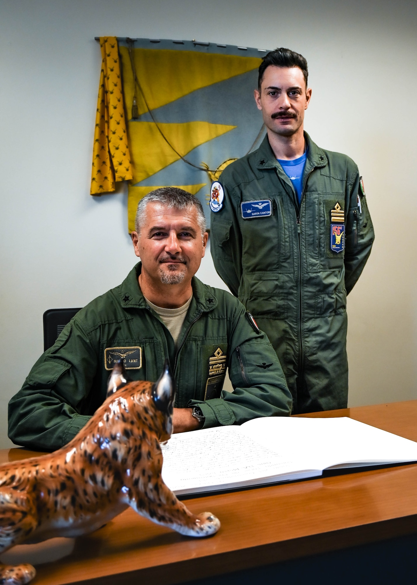 Italian Maj. Gen. Marco Lant (left), Italian Air Force Combat Forces commander, and Maj. Daniele Cantori (right), 62nd Fighter Squadron Italian detachment commander, pose for a photo