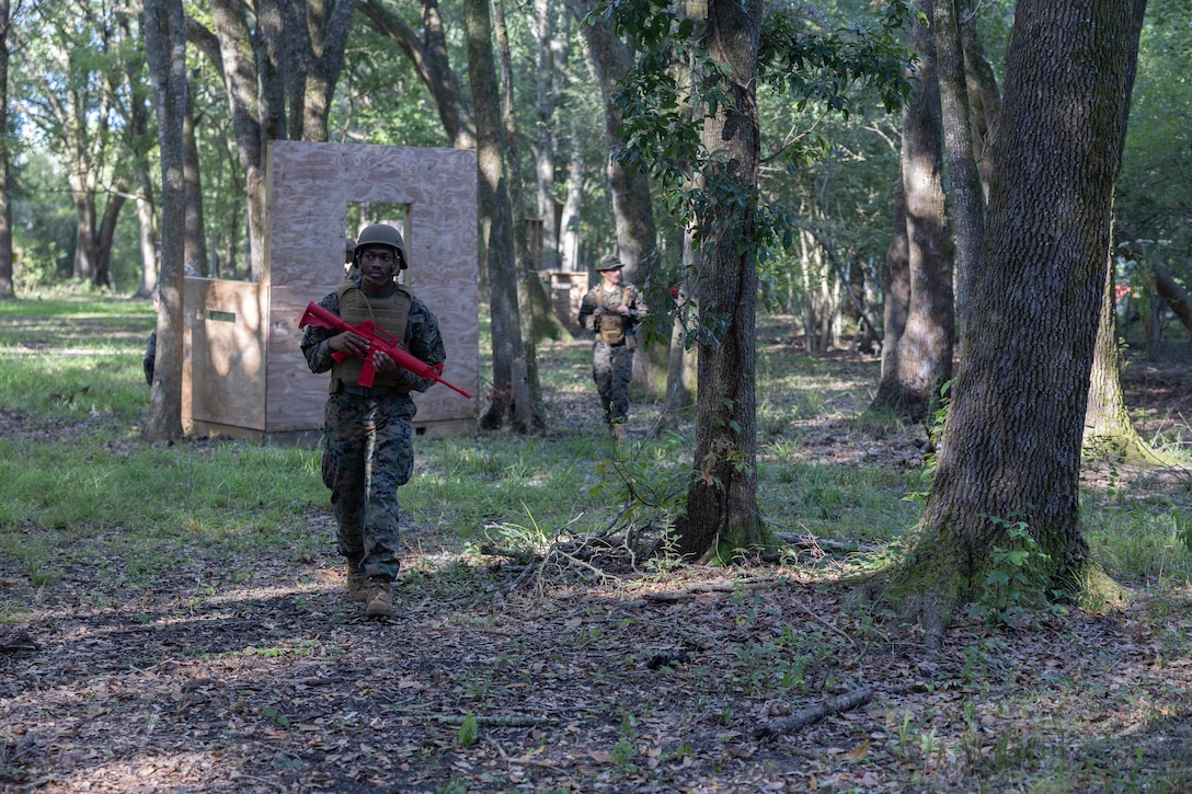 U.S. Marine Corps Cpl. Jahmir Harris, an administrative specialist with Headquarters Battalion, Marine Forces Reserve, patrols during the Corporals Course 4-25 field exercise, Naval Air Station-Joint Reserve Base New Orleans, Belle Chasse, Louisiana, Sept. 26, 2025.  The field exercise tested the Marines’ leadership, decision making, and small unit tactics in a simulated environment. (U.S. Marine Corps photo by Cpl. Kanoa Thomas)