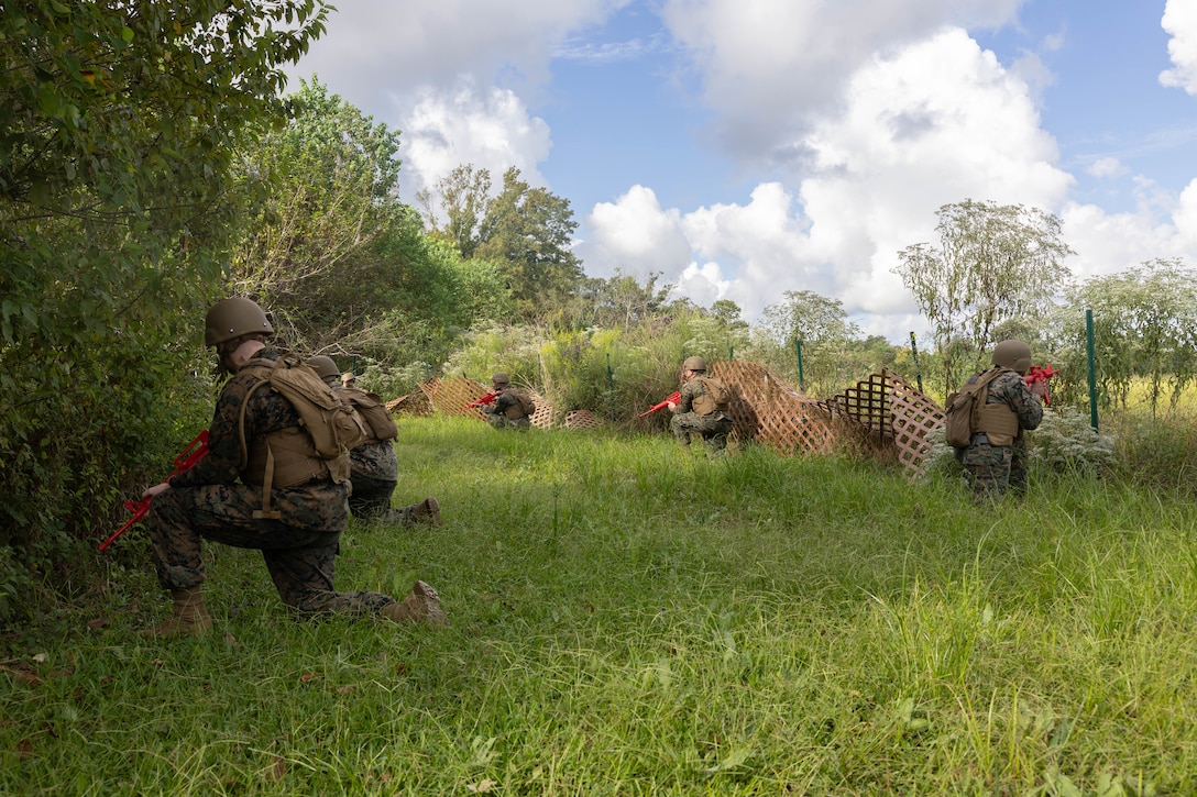 U.S. Marines with Headquarters Battalion, Marine Forces Reserve, post security during a patrol as part of the Corporals Course 4-25 field exercise, Naval Air Station-Joint Reserve Base New Orleans, Belle Chasse, Louisiana, Sept. 26, 2025.  The field exercise tested the Marines’ leadership, decision making, and small unit tactics in a simulated environment. (U.S. Marine Corps photo by Cpl. Kanoa Thomas)