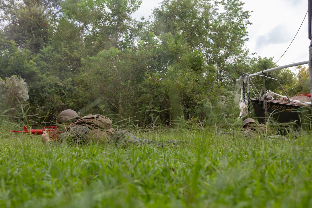 U.S. Marines with Headquarters Battalion, Marine Forces Reserve, post security during a patrol as part of the Corporals Course 4-25 field exercise, Naval Air Station-Joint Reserve Base New Orleans, Belle Chasse, Louisiana, Sept. 26, 2025.  The field exercise tested the Marines’ leadership, decision making, and small unit tactics in a simulated environment. (U.S. Marine Corps photo by Cpl. Kanoa Thomas)