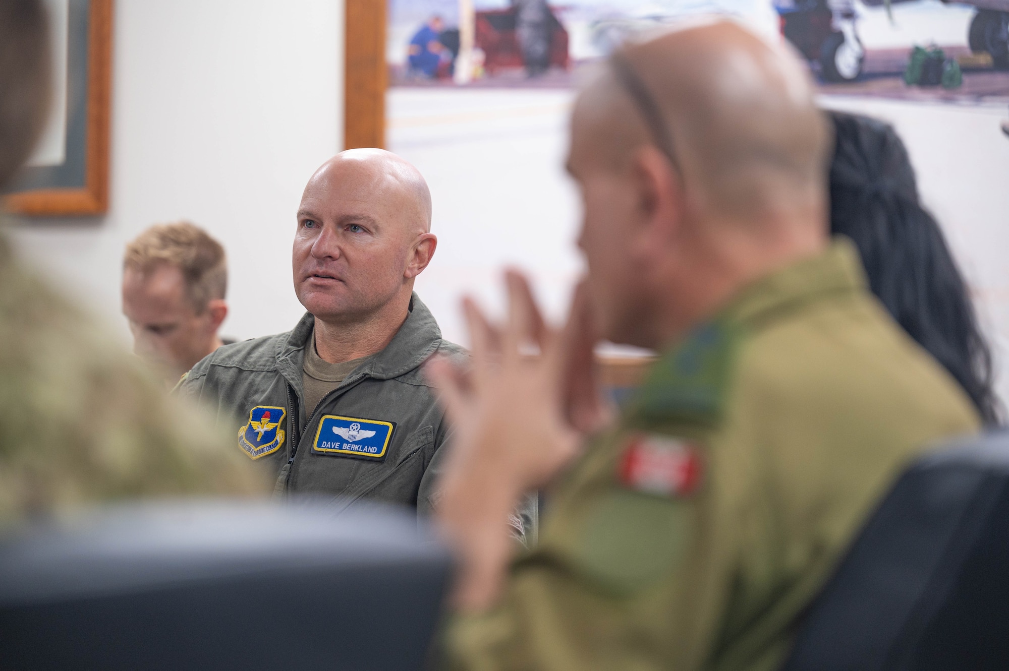 U.S. Air Force Brig. Gen. David Berkland, 56th Fighter Wing commander, gives a mission brief to members of the Royal Canadian Air Force during a base visit, Oct. 28, 2025, at Luke Air Force Base, Arizona.