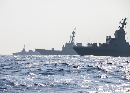 The Israel Defense Force SA’AR 6-class corvette INS Magen, left, the Arleigh Burke-class guided-missile destroyer USS Mitscher (DDG 57), center, and the Israel Defense Force SA’AR 5-class corvette INS Hanit sail in formation during a passing exercise (PASSEX) in the U.S. Central Command (CENTCOM) area of responsibility, Nov. 13, 2025. Mitscher is deployed to the U.S. 5th Fleet area of operations to support maritime security and stability in the CENTCOM area of responsibility.