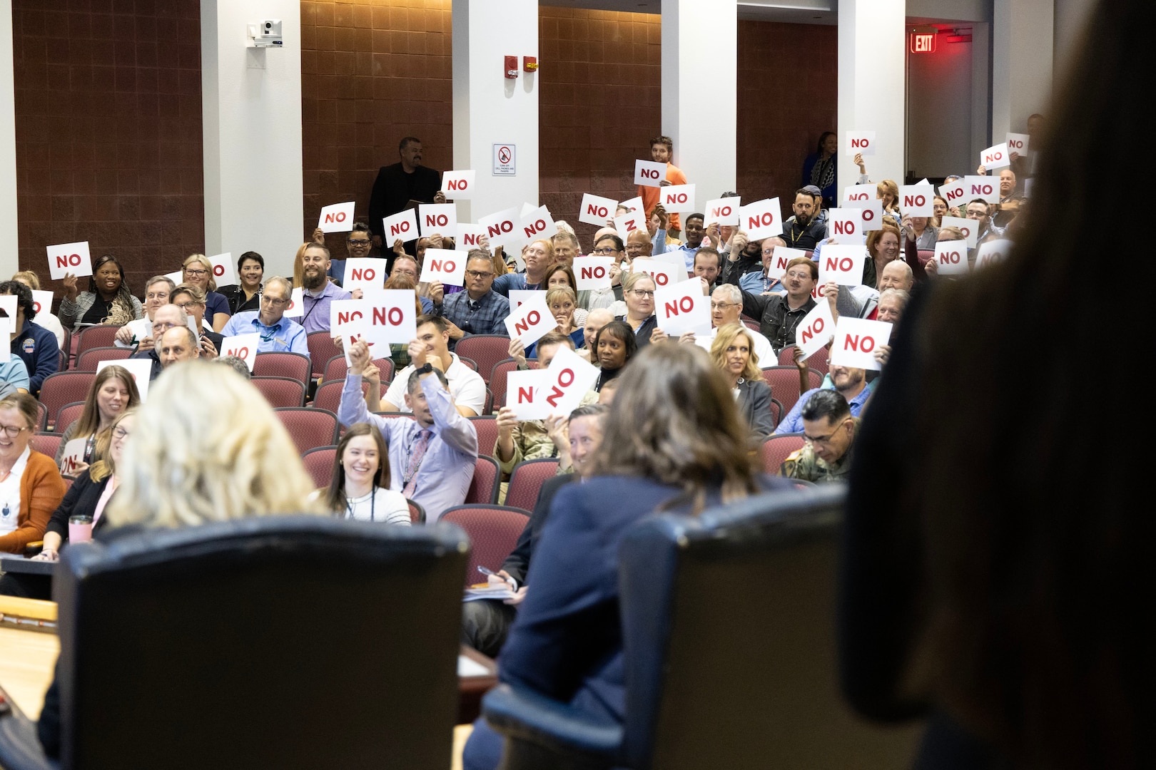 The crowd weighs in on a question in an auditorium.