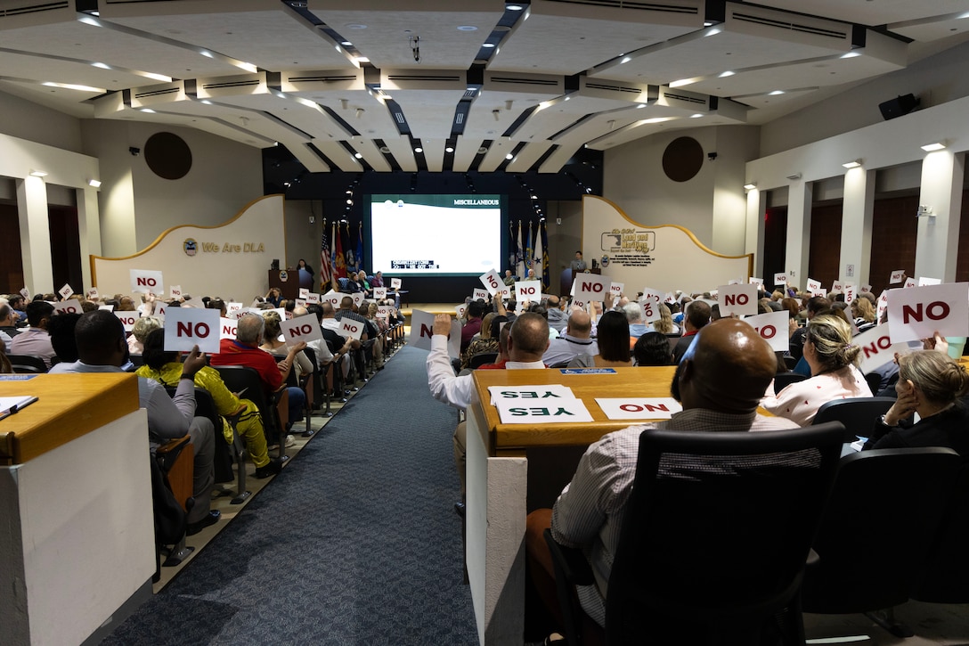 A auditorium filled to capacity.
