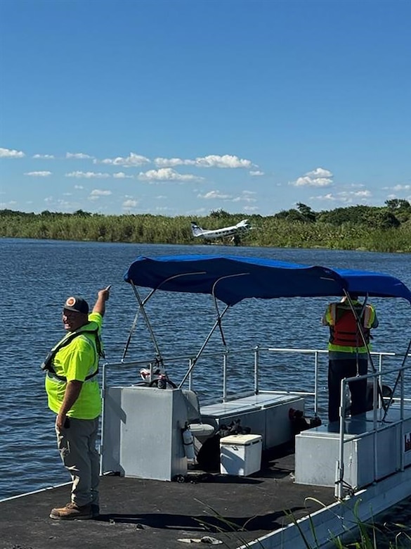 Jacksonville District employees, Steven Klemme and Graham Thompson use the South Florida Operations workboat to reach the crash site then eventually ferry the plane’s passengers across the canal to first responders waiting on the shoreline.