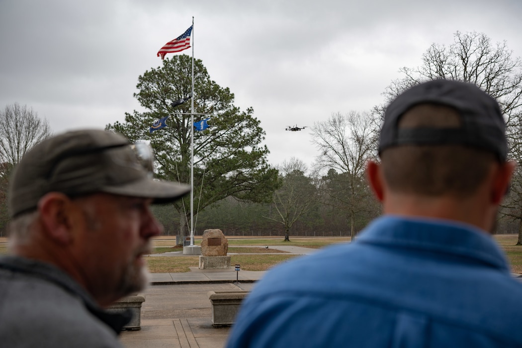 Robert Hastings, Small Unmanned Aircraft System operator at Arnold Air Force Base, right, pilots a drone while receiving input from Matt Holder, sUAS observer at Arnold, during a March 5, 2025, demonstration of the drone used to conduct asset health assessments at Arnold AFB, Tenn., headquarters of Arnold Engineering Development Complex. While the pictured drone is maintained and operated by Arnold personnel, others seen flying above or around the base may not be. The Arnold AFB sUAS Office and AEDC leadership at Arnold are asking members of the public living in the communities surrounding Arnold AFB to report suspicious drone activity. (U.S. Air Force photo by Keith Thornburgh)