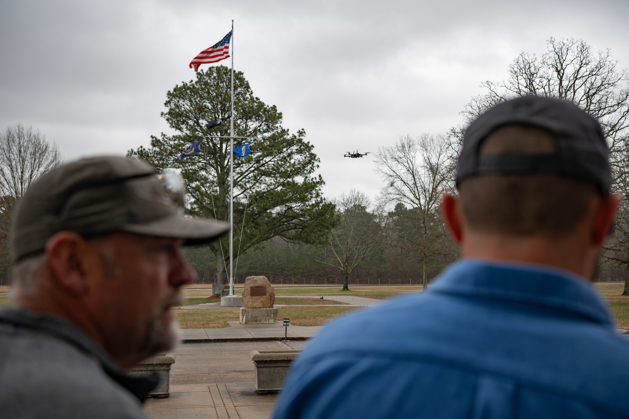 Robert Hastings, Small Unmanned Aircraft System operator at Arnold Air Force Base, right, pilots a drone while receiving input from Matt Holder, sUAS observer at Arnold, during a March 5, 2025, demonstration of the drone used to conduct asset health assessments at Arnold AFB, Tenn., headquarters of Arnold Engineering Development Complex. While the pictured drone is maintained and operated by Arnold personnel, others seen flying above or around the base may not be. The Arnold AFB sUAS Office and AEDC leadership at Arnold are asking members of the public living in the communities surrounding Arnold AFB to report suspicious drone activity. (U.S. Air Force photo by Keith Thornburgh)