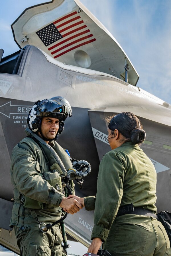 A U.S. Marine Corps F-35B Lightning II pilot thanks an aircraft maintainer, both serving with Marine Fighter Attack Squadron (VMFA) 225, U.S. Marine Corps Forces, South, at Jose Aponte de la Torre Airport, Puerto Rico, Oct. 17, 2025. U.S. military forces are deployed to the Caribbean in support of the U.S. Southern Command mission, Department of War-directed operations, and the president’s priorities to disrupt illicit drug trafficking and protect the homeland. (U.S. Marine Corps photo by Lance Cpl. Michael Gavin)