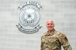 U.S. Air Force Senior Master Sgt. Tavis J. Delaney, 118th Air Support Operations Squadron (118 ASOS) Tactical Air Control Party (TACP) superintendent, poses for a photo outside of the 118 ASOS building at the New London Air National Guard base, N.C., August 1, 2025.