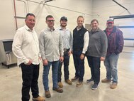 U.S. Army Corps of Engineers Sacramento District personnel gather inside the new Squadron Operations and Aircraft Maintenance Unit facility at Beale Air Force Base, California on Nov. 14, 2025.