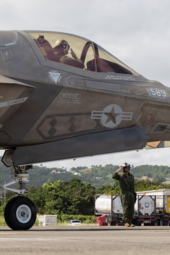 A U.S. Marine with Marine Fighter Attack Squadron (VMFA) 225, U.S. Marine Corps Forces, South, salutes a U.S. Marine Corps F-35B Lightning II pilot assigned to VMFA-225 at Jose Aponte de la Torre Airport in Ceiba, Puerto Rico, Oct. 28, 2025. U.S. military forces are deployed to the Caribbean in support of the U.S. Southern Command mission, Department of War-directed operations, and the president’s priorities to disrupt illicit drug trafficking and protect the homeland. (U.S. Marine Corps photo by Lance Cpl. Michael Gavin)