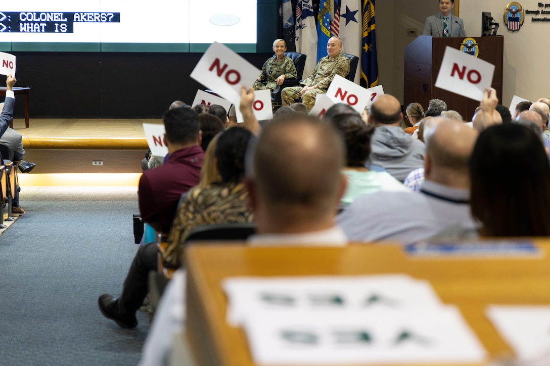 The crowd weighs in during a mock Jeopardy game.