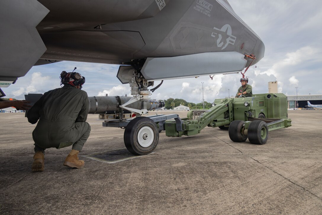 U.S. Marines with Marine Fighter Attack Squadron (VMFA) 225, U.S. Marine Corps Forces, South, load a GBU-54 Laser Joint Direct Attack Munition into a U.S. Marine Corps F-35B Lightning II assigned to VMFA-225 at Jose Aponte de la Torre Airport, Puerto Rico, Oct. 25, 2025. U.S. military forces are deployed to the Caribbean in support of the U.S. Southern Command mission, Department of War-directed operations, and the president’s priorities to disrupt illicit drug trafficking and protect the homeland. (U.S. Marine Corps photo)