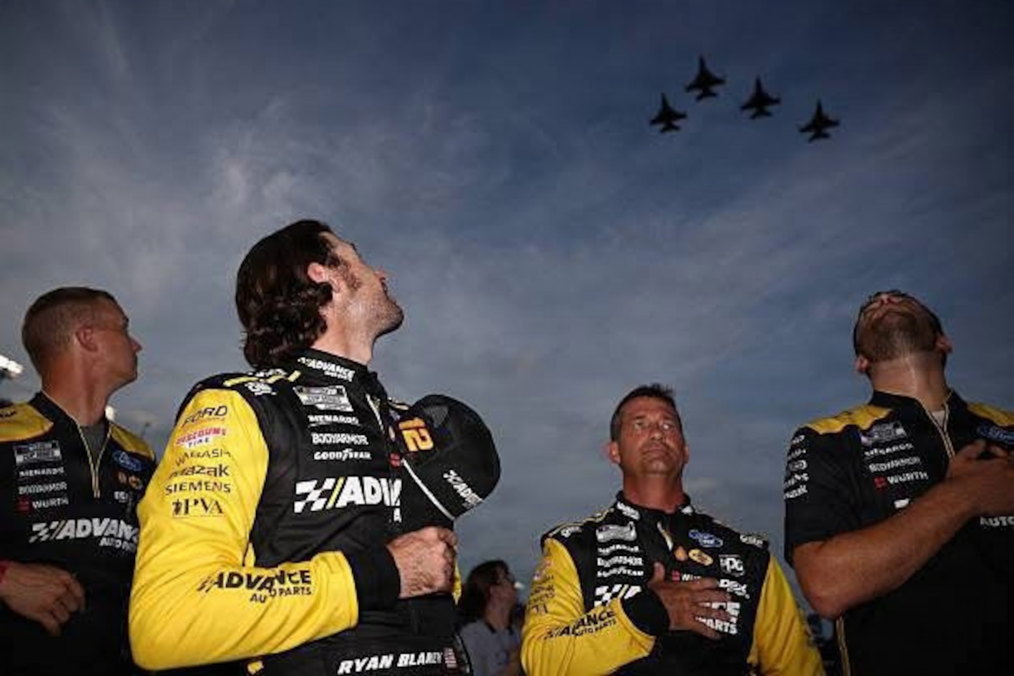 A crew participating in the Daytona 500 watch overhead as the 120th Fighter Squadron, Colorado Air National Guard, perform a flyover Aug. 23, 2025, at Daytona Beach, Florida.