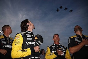 A crew participating in the Daytona 500 watch overhead as the 120th Fighter Squadron, Colorado Air National Guard, perform a flyover Aug. 23, 2025, at Daytona Beach, Florida.