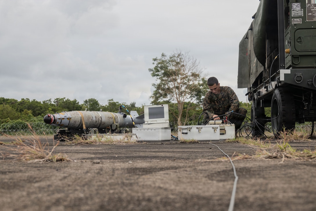 A U.S. Marine with Marine Fighter Attack Squadron (VMFA) 225, U.S. Marine Corps Forces, South, sets up a Common Munitions Bit Reprogramming Equipment system at Jose Aponte de la Torre Airport, Puerto Rico, Oct. 25, 2025. U.S. military forces are deployed to the Caribbean in support of the U.S. Southern Command mission, Department of War-directed operations, and the president’s priorities to disrupt illicit drug trafficking and protect the homeland. (U.S. Marine Corps photo)
