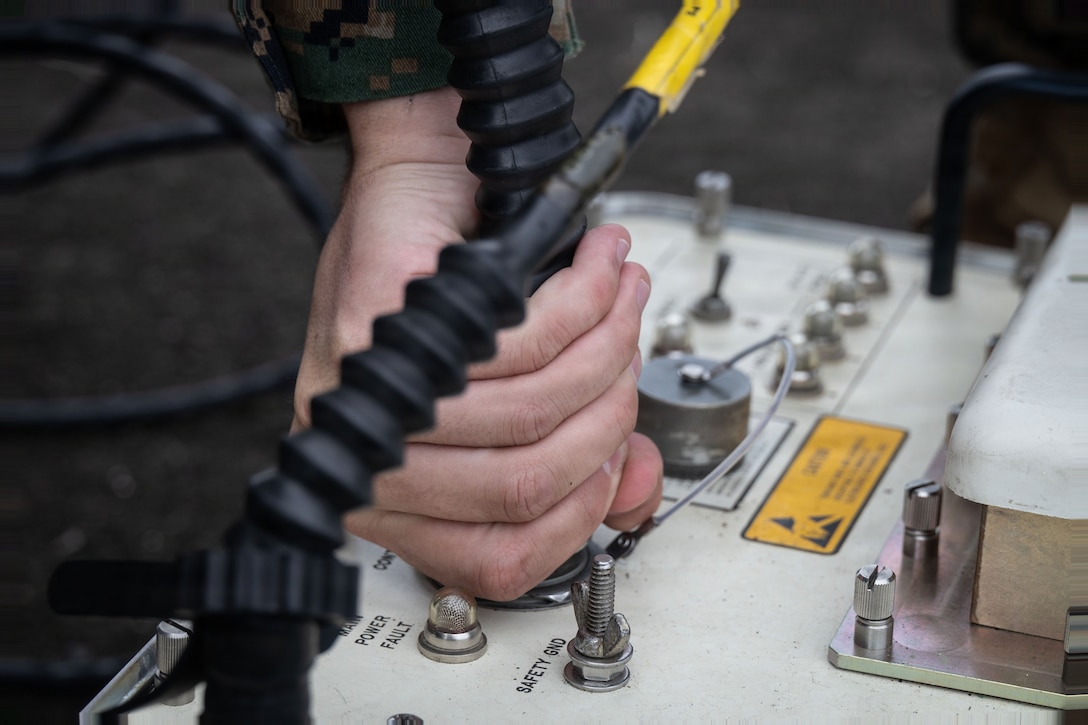 A U.S. Marine with Marine Fighter Attack Squadron (VMFA) 225, U.S. Marine Corps Forces, South, sets up a Common Munitions Bit Reprogramming Equipment system at Jose Aponte de la Torre Airport, Puerto Rico, Oct. 25, 2025. U.S. military forces are deployed to the Caribbean in support of the U.S. Southern Command mission, Department of War-directed operations, and the president’s priorities to disrupt illicit drug trafficking and protect the homeland. (U.S. Marine Corps photo)
