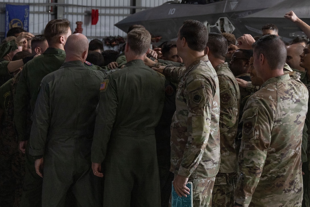 US. Airmen with Air Forces Southern and U.S. Marines with Marine Fighter Attack Squadron (VMFA) 225, U.S. Marine Corps Forces, South, conduct a unit ritual at Jose Aponte de la Torre Airport in Ceiba, Puerto Rico, Oct. 29, 2025. U.S. military forces are deployed to the Caribbean in support of the U.S. Southern Command mission, Department of War-directed operations, and the president’s priorities to disrupt illicit drug trafficking and protect the homeland. (U.S. Marine Corps photo)
