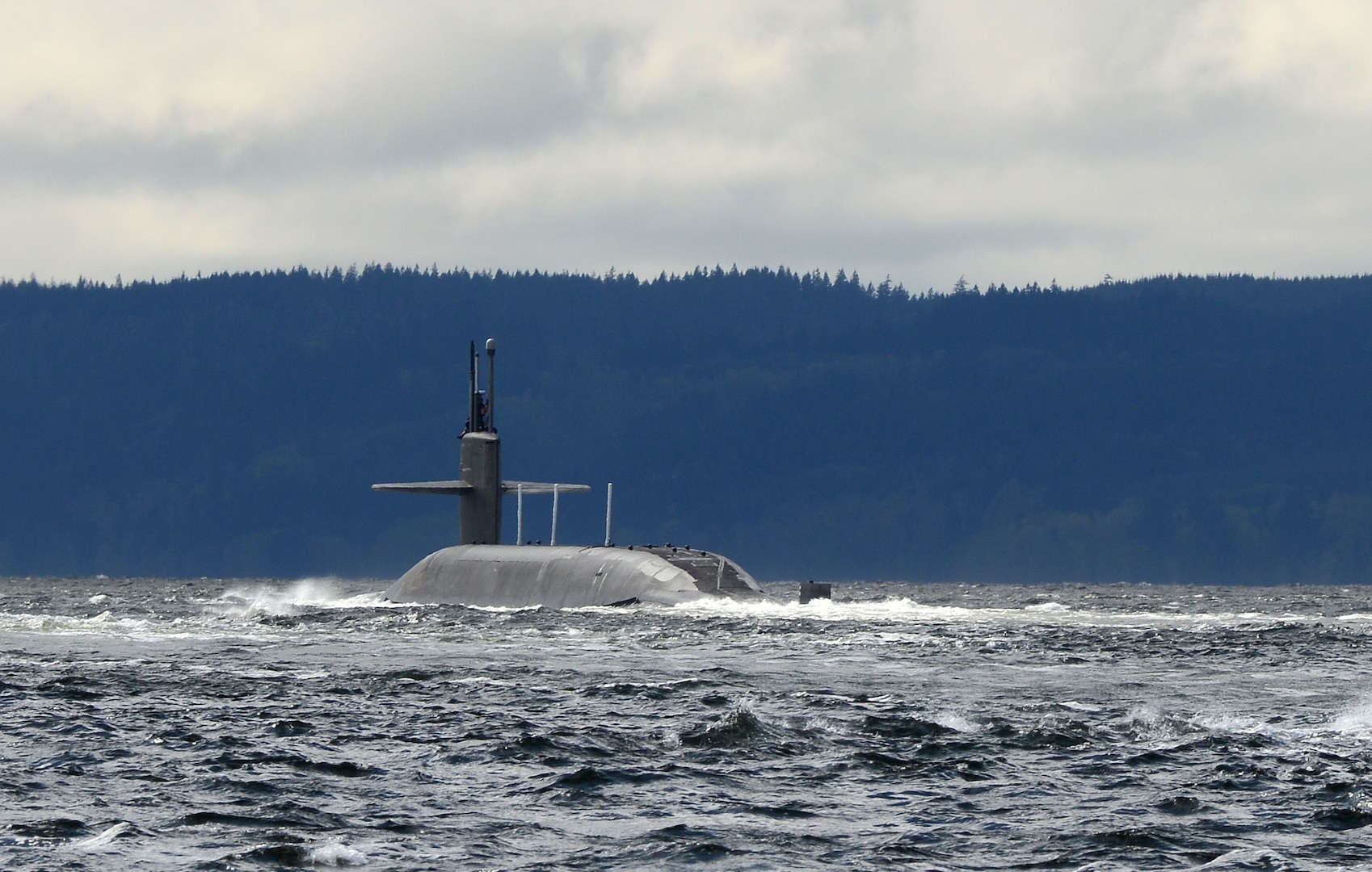 POULSBO, Wash. – The Ohio-class ballistic missile submarine USS Pennsylvania (SSBN 735) returns to its home port at Naval Base Kitsap after completing a strategic deterrent patrol in 2015. The U.S. Navy is consistently deployed to maintain peace, protect commerce and deter aggression through its forward presence. Dan Hogan served aboard Pennsylvania from 2001 to 2004. (Photo by Kenneth G. Takada, Mass Communication Specialist 1st Class/U.S. Navy)