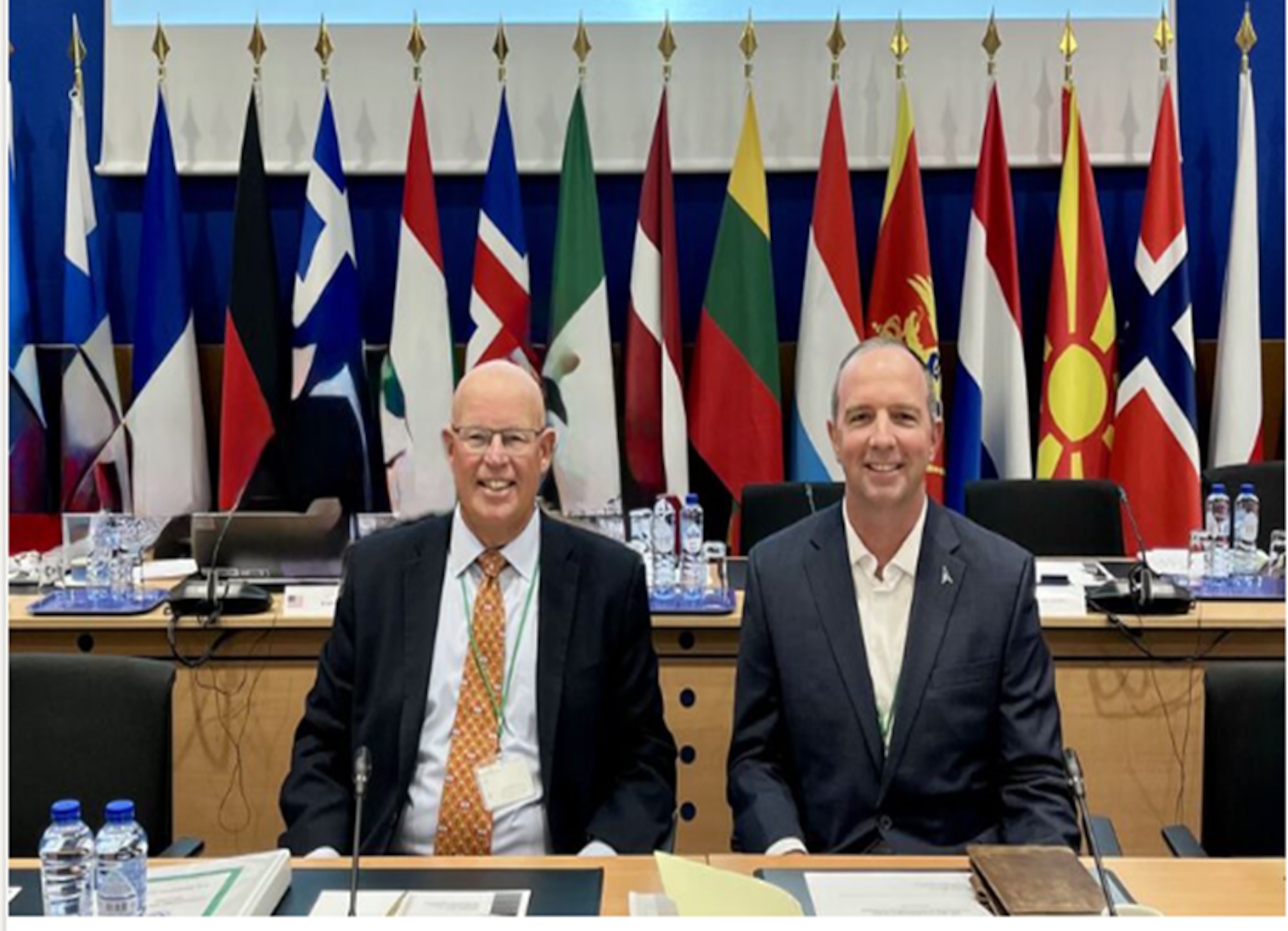 Mr. John Skudlarek, DoW CIO (left)  and USSF Col. Neil Barnas, SYD 831 Commander (right) present a Memorandum of Understanding enabling allied nations to build and share military Global Positioning System (GPS) User Equipment, September 9-10 at the North Atlantic Treaty Organization Support and Procurement Agency in Capellen, Luxembourg.  (Courtesy Photo)