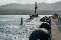 NAVAL BASE GUAM – The Los Angeles-class fast-attack submarine USS Jefferson City (SSN 759) moors at Naval Base Guam on Feb. 11, 2025. Known for their speed, endurance, stealth and mobility, fast-attack submarines are the backbone of the Navy’s submarine force. Dan Hogan served aboard Jefferson City between 2006-2009. (Lt. James Caliva/U.S. Navy Photo)