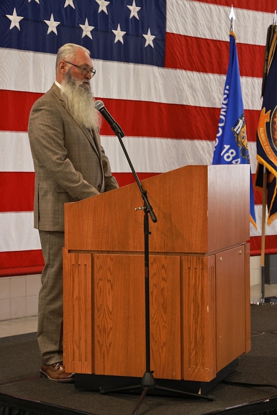Retired U.S. Army Chief Warrant Officer 4 David Molitor addresses the audience following his induction into the Wisconsin Army National Guard Hall of Honor Nov. 1, 2025, at the Department of Military Affairs facility in Madison, Wisconsin. The Hall of Honor program was established in 2000 to recognize Wisconsin National Guard Soldiers who have distinguished themselves through exceptional achievement and devotion to duty, significantly contributing to the enduring legacy of the organization. (U.S. National Guard photo by Paul Gorman)
