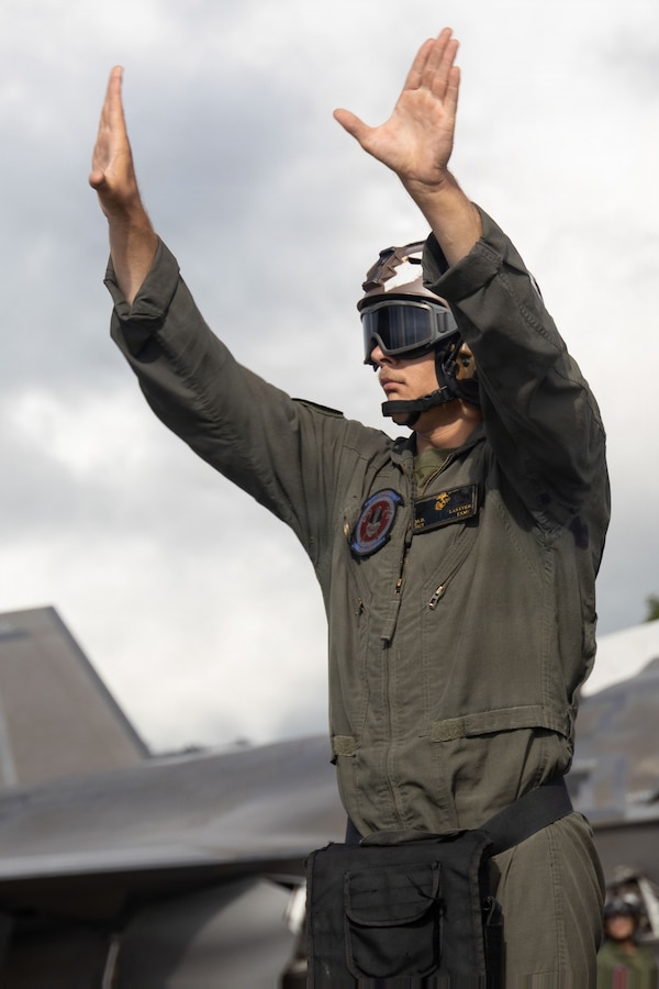 A U.S. Marine with Marine Fighter Attack Squadron (VMFA) 225, U.S. Marine Corps Forces, South, signals to a U.S. Marine Corps F-35B Lightning II assigned to VMFA-225 at Jose Aponte de la Torre Airport in Ceiba, Puerto Rico, Nov. 4, 2025. U.S. military forces are deployed to the Caribbean in support of the U.S. Southern Command mission, Department of War-directed operations, and the president’s priorities to disrupt illicit drug trafficking and protect the homeland. (U.S. Marine Corps photo)