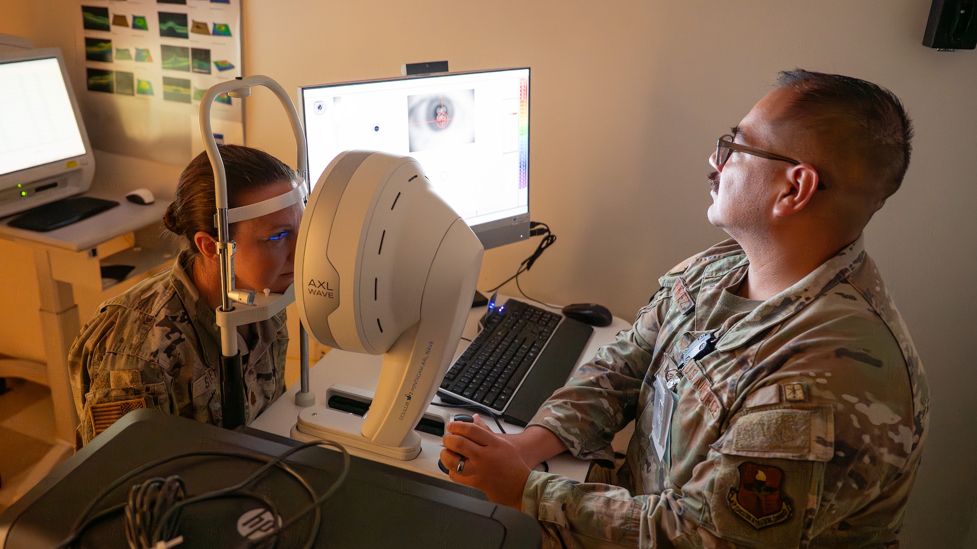 U.S Air Force Tech. Sgt. Gabino Gutierrez, 42d Medical Group human performance flight chief, performs a cornea check on Maj. Katelin Staley, 42d MDG physical medicine optometry flight commander, at Maxwell Air Force Base, Alabama, Oct. 30, 2025.