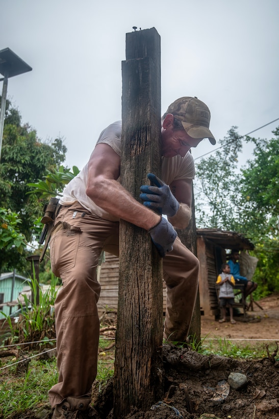 Dr. Kyle McCormick, Defense POW/MIA Accounting Agency (DPAA) scientific recovery expert, removes a post from a unit in preparation for excavation during a recovery mission on Guadalcanal, Solomon Islands, Aug. 9, 2024.