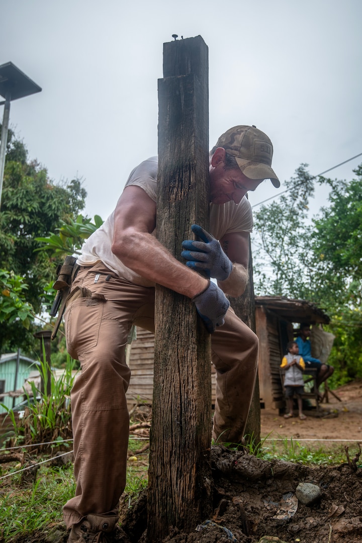 Dr. Kyle McCormick, Defense POW/MIA Accounting Agency (DPAA) scientific recovery expert, removes a post from a unit in preparation for excavation during a recovery mission on Guadalcanal, Solomon Islands, Aug. 9, 2024.