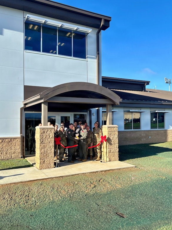 Leaders from the 940th Air Refueling Wing join U.S. Army Corps of Engineers Sacramento District representatives for a ribbon cutting celebrating the completion of the new Squadron Operations and Aircraft Maintenance Unit facility at Beale Air Force Base on Nov. 14, 2025.