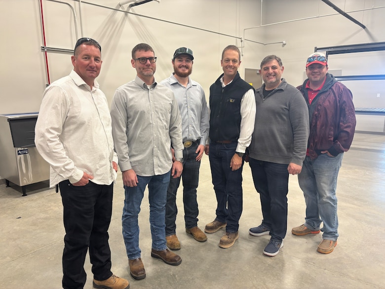 U.S. Army Corps of Engineers Sacramento District personnel gather inside the new Squadron Operations and Aircraft Maintenance Unit facility at Beale Air Force Base, California on Nov. 14, 2025.
